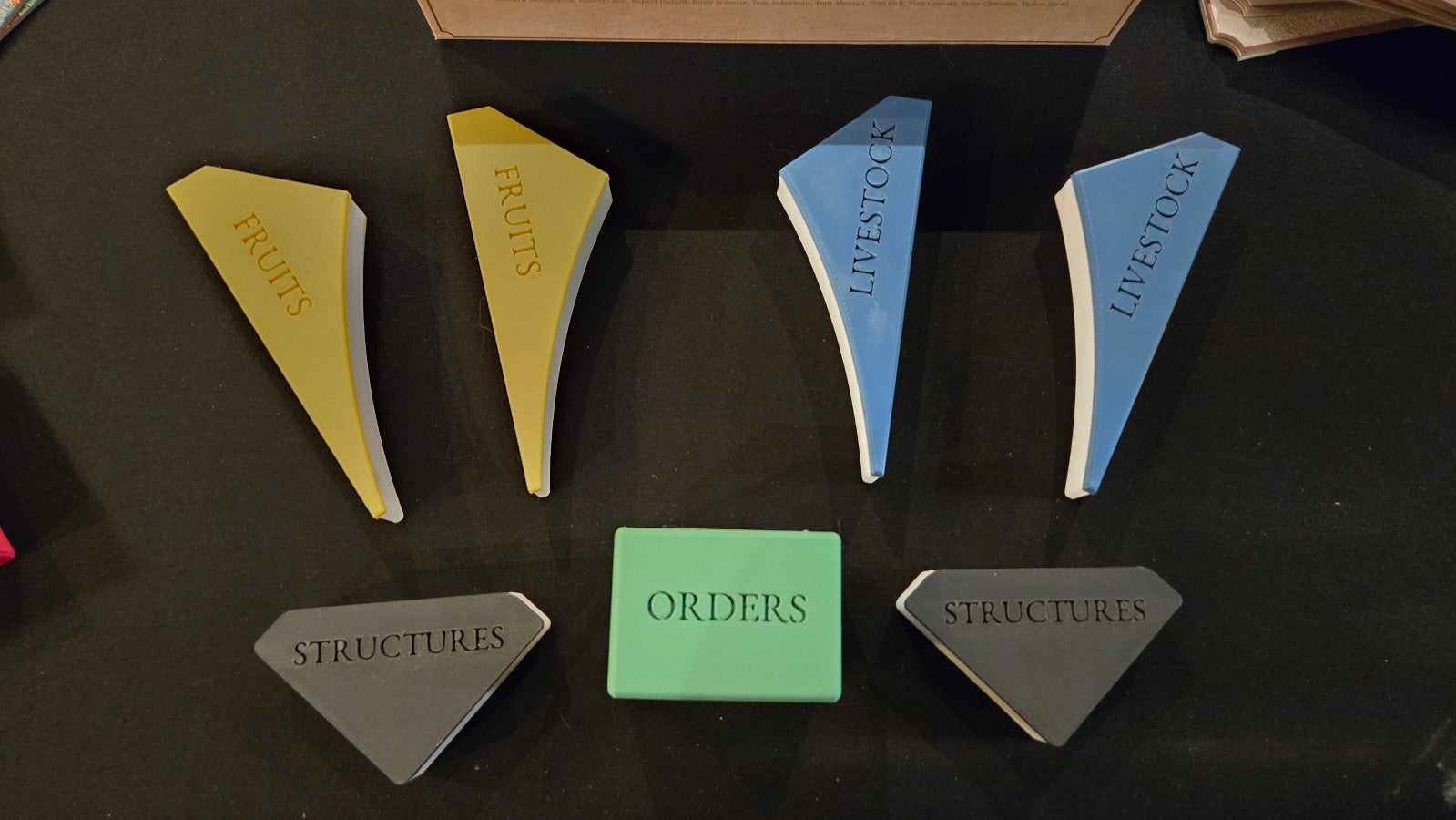 Set of geometric shapes with text on a dark surface
