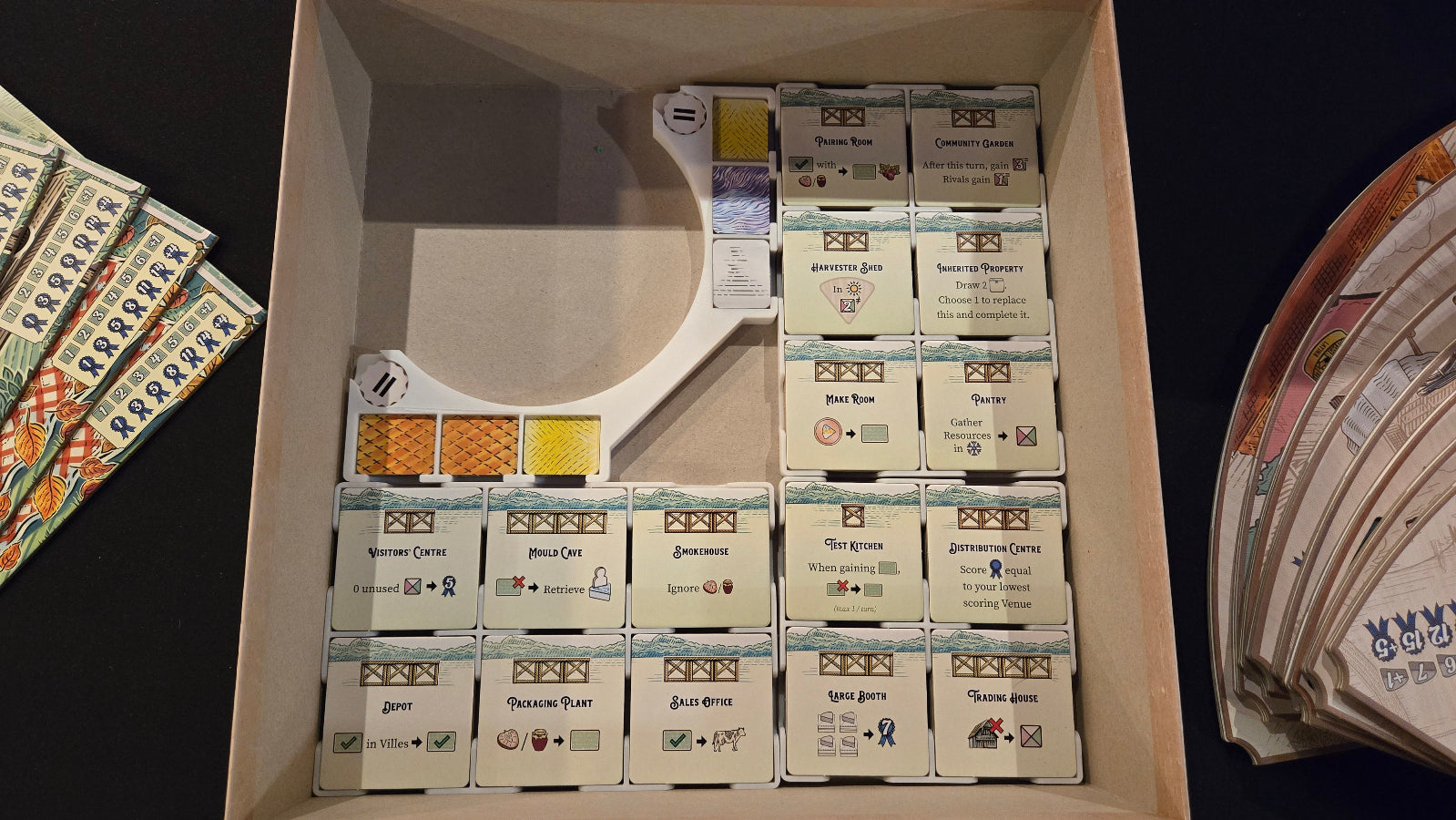 Box of premium cards with visible branding on a dark background