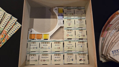 Box of premium cards with visible branding on a dark background