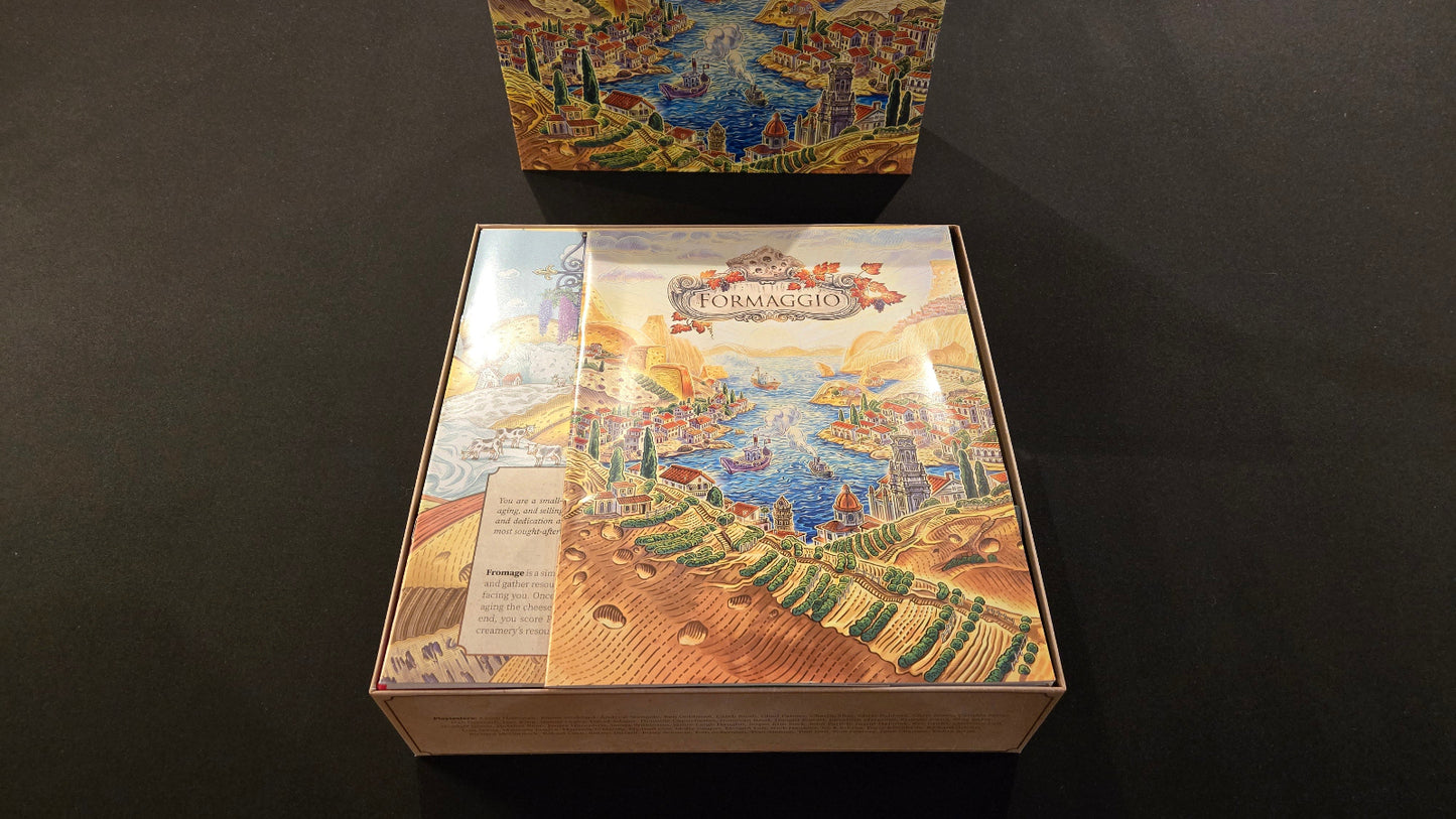 Board game box with colorful illustrations on a dark surface