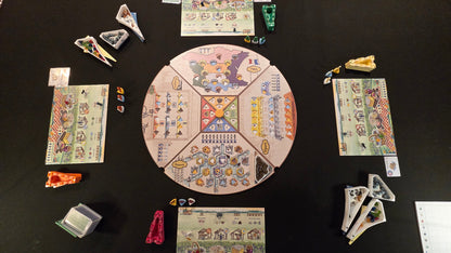Board game components on a dark surface