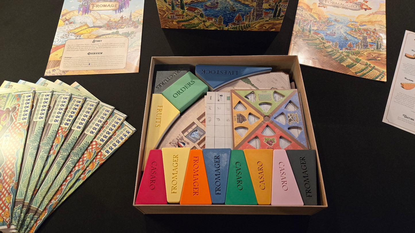 Collection of card games and game components on a dark surface
