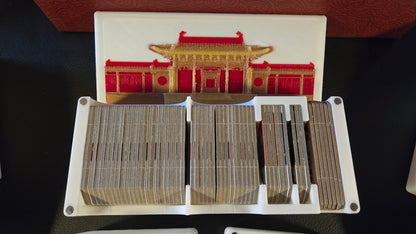 Set of cards with a miniature model of a traditional building on top