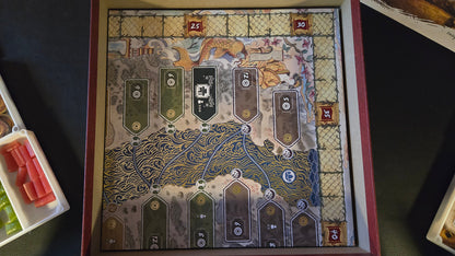 Decorative board game box with intricate design and card slots.