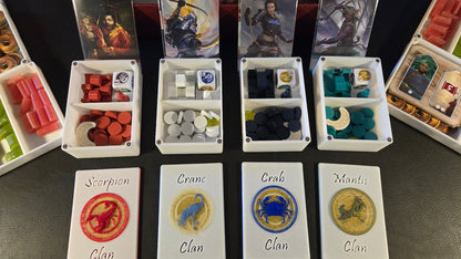 Board game components including cards and dice on a dark surface