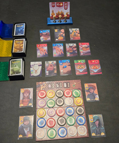 Collection of trading cards and collectible items on a dark surface