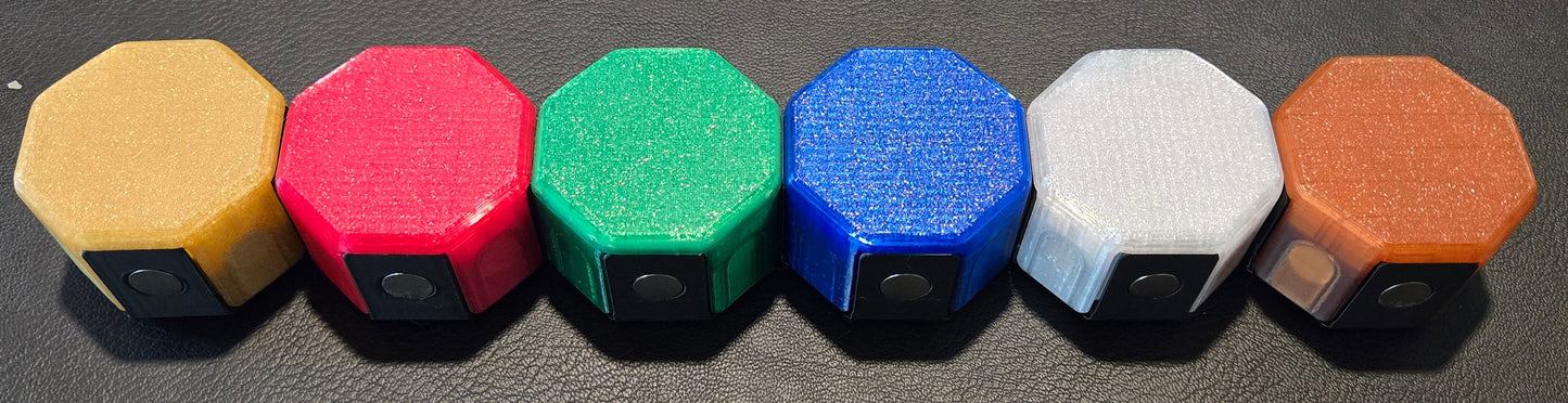 Colorful game pieces on a dark surface with 'Splendor' branding in the background.