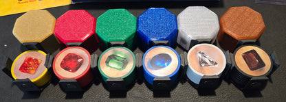 Collection of colorful game pieces with 'Splendor' box in the background