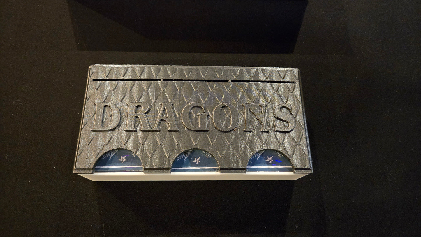 Cardboard box with 'My Dragons' branding on a black background